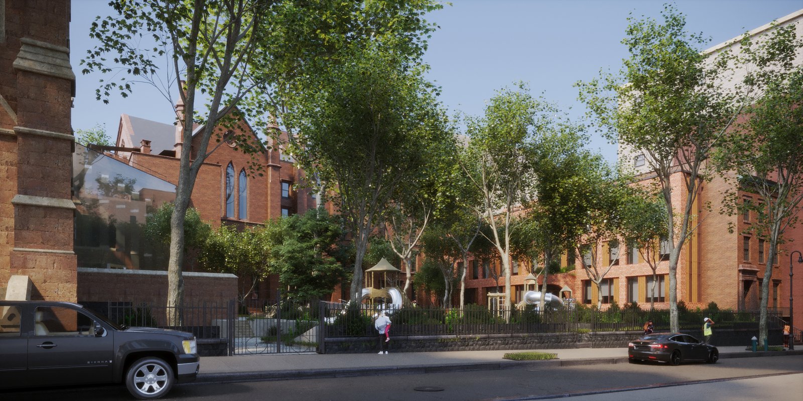 View of the Packer Collegiate campus framed by trees, showcasing historic red-brick buildings.